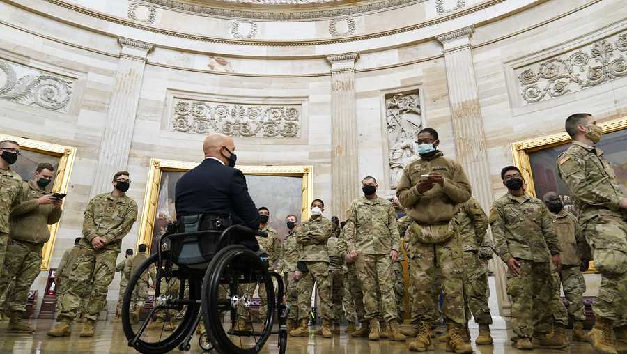 Rep. Brian Mast, R-Fla., gives troops a tour in the Rotunda on Capitol Hill in Washington, Wednesday, Jan. 13, 2021.