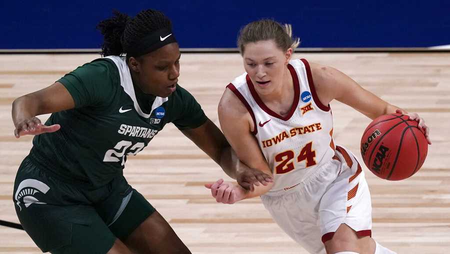 Iowa State guard Ashley Joens (24) drives past Michigan State guard Janai Crooms (23) during the first half of a college basketball game in the first round of the women&apos;s NCAA tournament at the Alamodome in San Antonio, Monday, March 22, 2021. (AP Photo/Charlie Riedel)