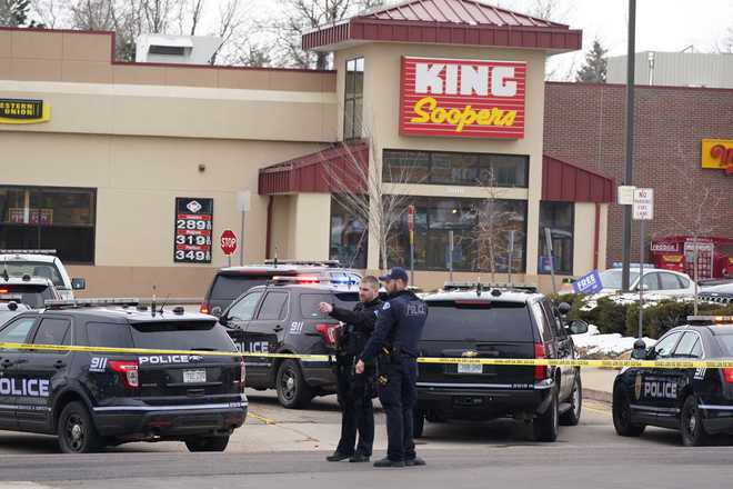 Police&#x20;work&#x20;on&#x20;the&#x20;scene&#x20;outside&#x20;of&#x20;a&#x20;King&#x20;Soopers&#x20;grocery&#x20;store&#x20;where&#x20;a&#x20;shooting&#x20;took&#x20;place&#x20;Monday,&#x20;March&#x20;22,&#x20;2021,&#x20;in&#x20;Boulder,&#x20;Colo.