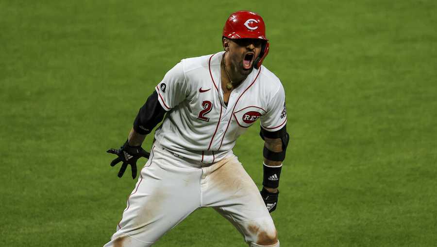 Cincinnati Reds&apos; Nick Castellanos reacts to hitting a solo home run during a baseball game against the Pittsburgh Pirates in Cincinnati, Monday, April 5, 2021. The Reds won 5-3. (AP Photo/Aaron Doster)