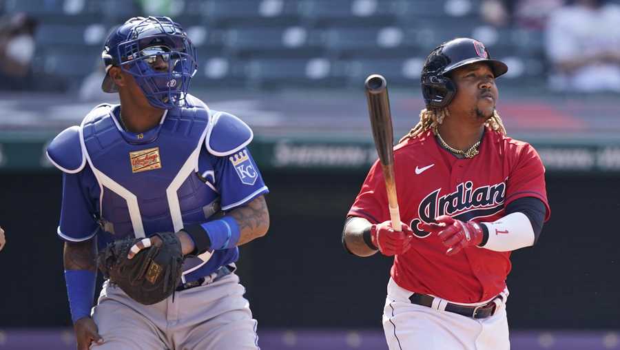 Cleveland Indians&apos; Jose Ramirez, right, watches his ball along with Kansas City Royals catcher Salvador Perez after Ramirez hit a two-run home run in the eighth inning of a baseball game, Wednesday, April 7, 2021, in Cleveland. The Indians won 4-2. (AP Photo/Tony Dejak)