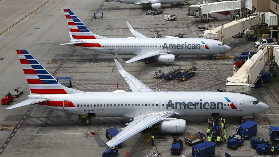 FILE - In this July 17, 2019 file photo American Airlines planes are parked on the tarmac at Phoenix Sky Harbor International Airport in Phoenix. American Airlines Group Inc. (AAL) on Thursday, April 22, 2021, reported a loss of $1.25 billion in its first quarter. (AP Photo/Ross D. Franklin, File)