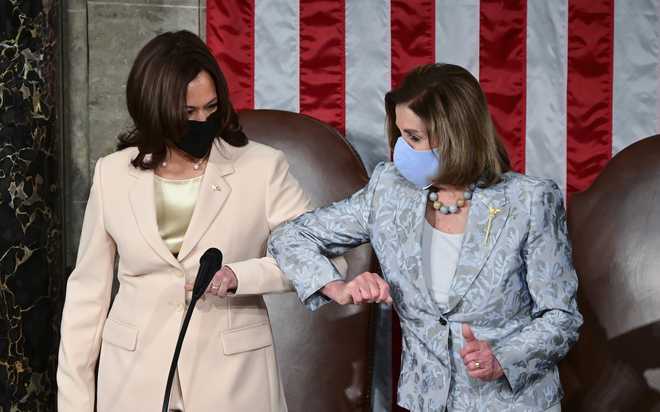 Vice&#x20;President&#x20;Kamala&#x20;Harris,&#x20;left,&#x20;greets&#x20;House&#x20;Speaker&#x20;Nancy&#x20;Pelosi&#x20;of&#x20;Calif.,&#x20;ahead&#x20;of&#x20;President&#x20;Joe&#x20;Biden&#x20;addressing&#x20;a&#x20;joint&#x20;session&#x20;of&#x20;Congress,&#x20;Wednesday,&#x20;April&#x20;28,&#x20;2021,&#x20;in&#x20;the&#x20;House&#x20;Chamber&#x20;at&#x20;the&#x20;U.S.&#x20;Capitol&#x20;in&#x20;Washington.