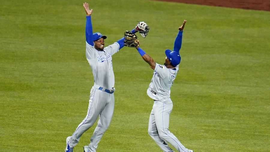 Kansas City Royals outfielders Jarrod Dyson (1) and Michael A. Taylor celebrate getting the final out of a 9-6 win over the Pittsburgh Pirates in a baseball game in Pittsburgh, Wednesday, April 28, 2021. (AP Photo/Gene J. Puskar)
