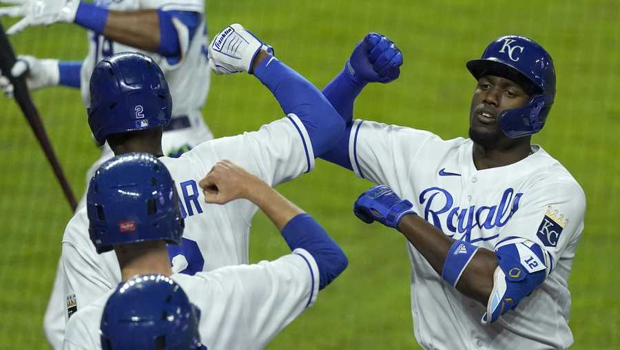 Kansas City Royals&apos; Jorge Soler, right, celebrate with teammates after hitting a solo home run during the seventh inning of a baseball game against the Milwaukee Brewers Wednesday, May 19, 2021, in Kansas City, Mo. (AP Photo/Charlie Riedel)
