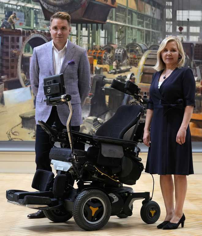 Lucy&#x20;and&#x20;Tim&#x20;Hawking&#x20;stand&#x20;with&#x20;the&#x20;wheelchair&#x20;used&#x20;by&#x20;their&#x20;late&#x20;father&#x20;Professor&#x20;Stephen&#x20;Hawking&#x20;which&#x20;has&#x20;been&#x20;acquired&#x20;by&#x20;the&#x20;Science&#x20;Museum&#x20;Group,&#x20;in&#x20;London,&#x20;Wednesday,&#x20;May&#x20;26,&#x20;2021.