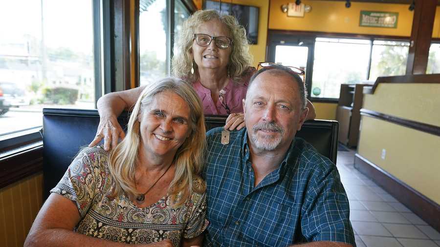 Two days after Debby-Neal Strickland, front left, and Jim Merthe were married in November, Debby donated a kidney to James' ex-wife Mylaen Merthe, center back, as the three get together Tuesday, May 25, 2021, at a restaurant in Ocala, Fla.