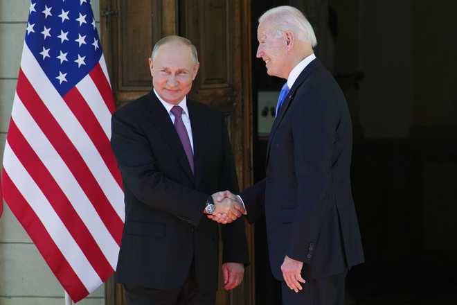 Russian President Vladimir Putin, left, and U.S President Joe Biden shake hands during their meeting at the &quot;Villa la Grange&quot; in Geneva, Switzerland in Geneva, Switzerland, Wednesday, June 16, 2021.