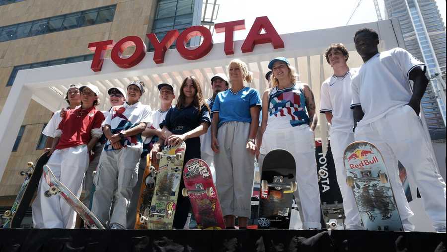 Members of the first U.S. Olympic skateboarding team pose for photos with their boards during a news conference in downtown Los Angeles on Monday, June 21, 2021. The team was introduced in Southern California, where the sport was invented roughly 70 years ago. Skateboarding is an Olympic sport for the first time in Tokyo, and the Americans are expected to be a strong team. (AP Photo/Richard Vogel)