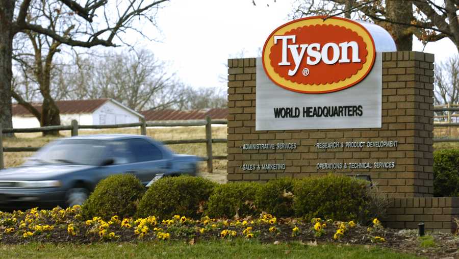 FILE - In this Jan. 29, 2006, file photo, a car passes in front of a Tyson Foods Inc., sign at Tyson headquarters in Springdale, Ark. Tyson Foods is recalling almost 4,500 tons of ready-to-eat chicken products after finding the products may be tainted with listeria bacteria. The U.S. Department of Agriculture announced the recall Thursday, July 8, 2021 after two consumers reported falling ill with listeriosis. (AP Photo/April L. Brown, File)