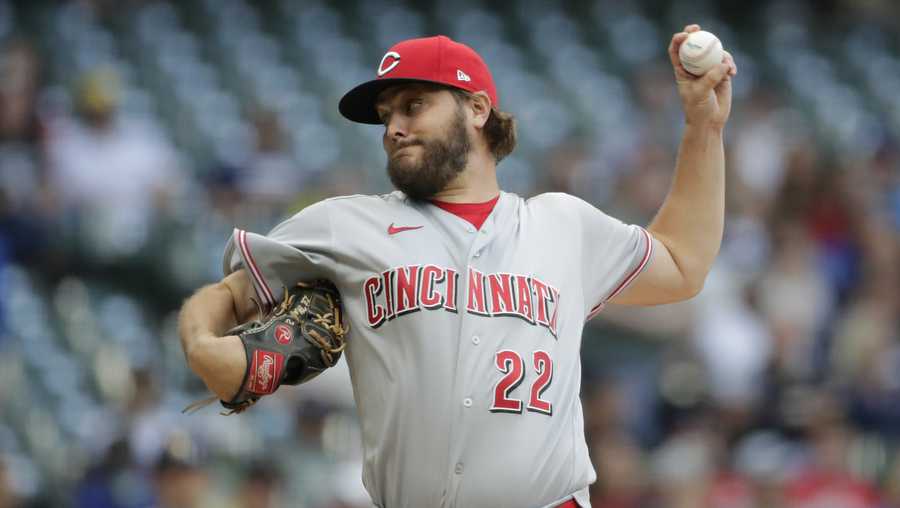 Cincinnati Reds' Wade Miley pitches during the first inning of the team's baseball game against the Milwaukee Brewers on Friday, July 9, 2021, in Milwaukee. (AP Photo/Aaron Gash)