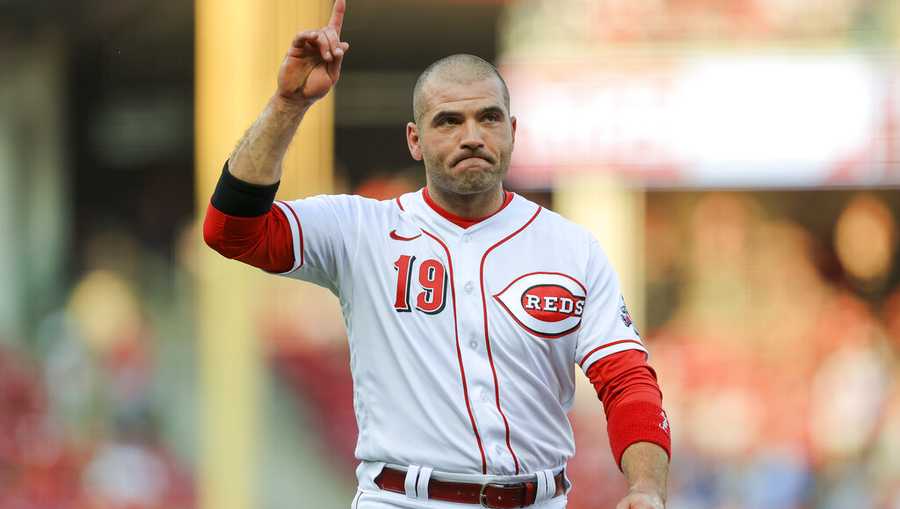Cincinnati Reds' Joey Votto acknowledges the crowd after the first inning of a baseball game against the St. Louis Cardinals in Cincinnati, Friday, July 23, 2021. Votto became the fourth all-time RBI leader for the Reds in the first inning. (AP Photo/Aaron Doster)