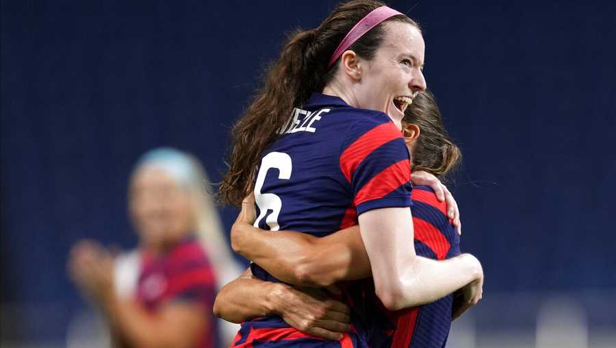 United States' Rose Lavelle, left, celebrates after scoring a goal during a women's soccer match against New Zealand at the 2020 Summer Olympics, Saturday, July 24, 2021, in Saitama, Japan. (AP Photo/Martin Mejia)