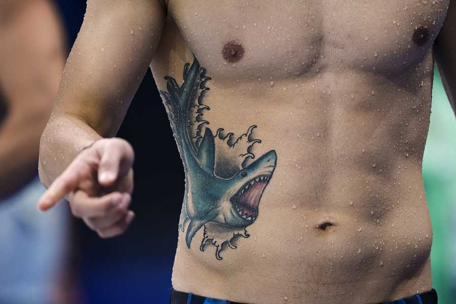 A swimmer gestures during a training session at the Tokyo Aquatics Centre venue for the swimming competitions at the 2020 Summer Olympics, Sunday, July 25, 2021, in Tokyo, Japan. (AP Photo/Martin Meissner) A swimmer gestures during a training session at the Tokyo Aquatics Centre venue for the swimming competitions at the 2020 Summer Olympics, Sunday, July 25, 2021, in Tokyo, Japan. (AP Photo/Martin Meissner)