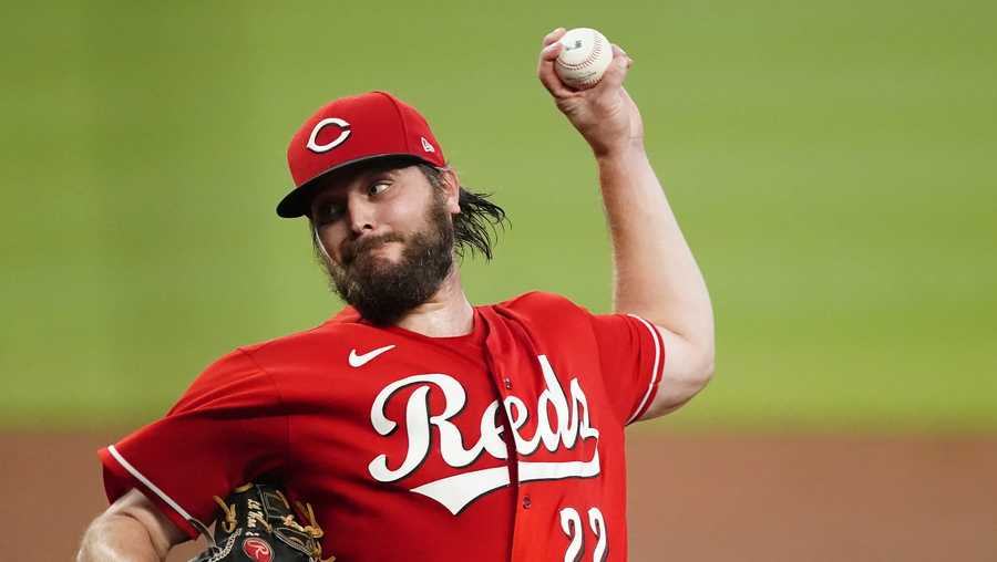 Cincinnati Reds starting pitcher Wade Miley works against the Atlanta Braves during the third inning of a baseball game Wednesday, Aug. 11, 2021, in Atlanta. (AP Photo/John Bazemore)