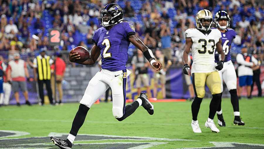 Baltimore Ravens quarterback Tyler Huntley (2) scores a touchdown on a keeper against the New Orleans Saints during the second half of an NFL preseason football game, Saturday, Aug. 14, 2021, in Baltimore. (AP Photo/Nick Wass)