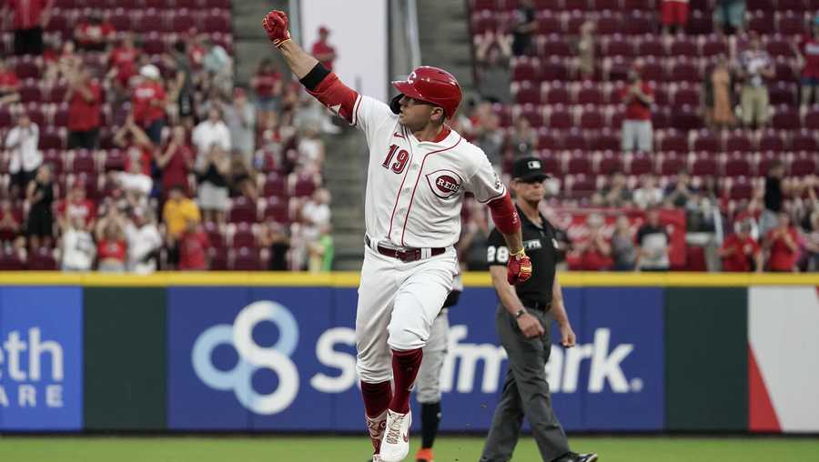 Cincinnati Reds' Joey Votto celebrates after hitting a three-run home run during the fourth inning of the team's baseball game against the Miami Marlins o Thursday, Aug. 19, 2021, in Cincinnati. (AP Photo/Jeff Dean)