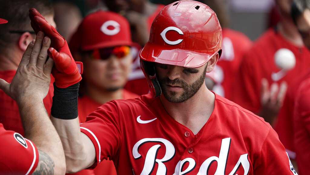 Naquin homers twice, Reds beat Marlins 3-1 to sweep series