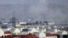 Smoke rises from a deadly explosion outside the airport in Kabul, Afghanistan, Thursday, Aug. 26, 2021.