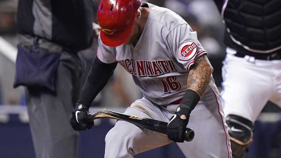 Cincinnati Reds&apos; Tucker Barnhart breaks his bat over his leg after striking out during the sixth inning of the team&apos;s baseball game against the Miami Marlins, Saturday, Aug. 28, 2021, in Miami. (AP Photo/Wilfredo Lee)