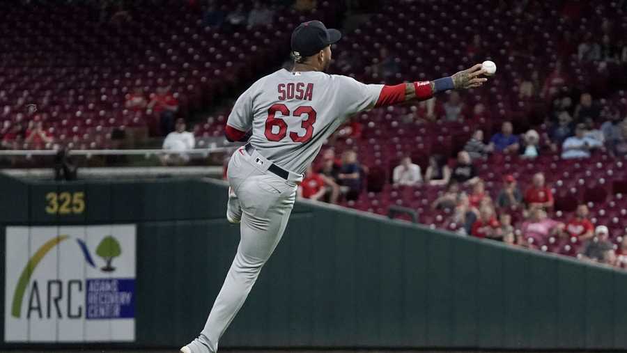 St. Louis Cardinals shortstop Edmundo Sosa (63) throws Cincinnati Reds' Asdrubal Cabrera out at first during the sixth inning of a baseball game Monday, Aug. 30, 2021, in Cincinnati. (AP Photo/Jeff Dean)