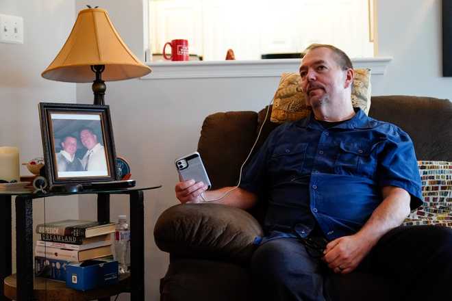 Ed&#x20;Bisch,&#x20;who&#x20;lost&#x20;his&#x20;18-year-old&#x20;son&#x20;Eddie&#x20;to&#x20;an&#x20;overdose&#x20;nearly&#x20;20&#x20;years&#x20;ago,&#x20;listens&#x20;on&#x20;speakerphone&#x20;from&#x20;his&#x20;home&#x20;in&#x20;Westampton,&#x20;N.J.,&#x20;to&#x20;a&#x20;bankruptcy&#x20;judge&#x20;Wednesday,&#x20;Sept.&#x20;1,&#x20;2021,&#x20;on&#x20;a&#x20;plan&#x20;for&#x20;OxyContin&#x20;maker&#x20;Purdue&#x20;Pharma&#x20;to&#x20;settle&#x20;thousands&#x20;of&#x20;lawsuits&#x20;brought&#x20;by&#x20;state&#x20;and&#x20;local&#x20;governments&#x20;and&#x20;others&#x20;over&#x20;opioids.&#x20;Bisch,&#x20;who&#x20;has&#x20;spent&#x20;more&#x20;than&#x20;a&#x20;decade&#x20;pushing&#x20;for&#x20;the&#x20;Sacklers&#x20;to&#x20;be&#x20;criminally&#x20;prosecuted,&#x20;is&#x20;leading&#x20;a&#x20;group&#x20;of&#x20;families&#x20;that&#x20;are&#x20;asking&#x20;the&#x20;U.S.&#x20;Justice&#x20;Department&#x20;to&#x20;appeal&#x20;the&#x20;settlement.&#x20;&#x28;AP&#x20;Photo&#x2F;Matt&#x20;Rourke&#x29;