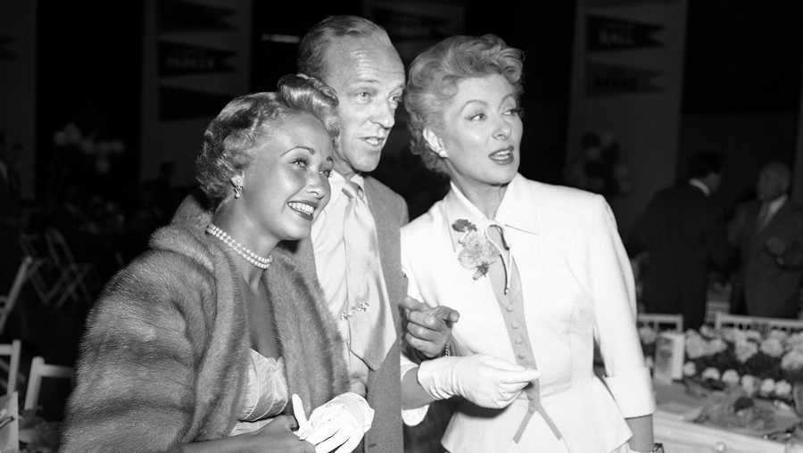 FILE - In this Sept. 9, 1953 file photo, Jane Powell, left, Fred Astaire, center and Greer Garson pose for a photo in Los Angeles. Jane Powell, the bright-eyed, operatic-voiced star of Hollywood&apos;s golden age musicals who sang with Howard Keel in “Seven Brides for Seven Brothers” and danced with Fred Astaire in “Royal Wedding,” has died. Thursday, Sept. 16, 2021. She was 92. (AP Photo/Ellis Bosworth, File)