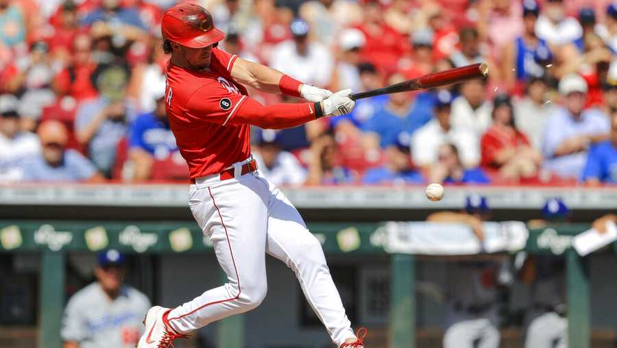 Cincinnati Reds Kyle Farmer singles during the second inning of a baseball game against the Los Angeles Dodgers in Cincinnati, Saturday, Sept. 18, 2021. (AP Photo/Aaron Doster)