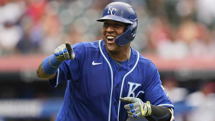 Kansas City Royals&apos; Salvador Perez smiles and points to the dugout after hitting a two-run home run in the fifth inning in the first baseball game of a doubleheader against the Cleveland Indians, Monday, Sept. 20, 2021, in Cleveland. The home run broke Johnny Bench&apos;s record for the most home runs in a season by a primary catcher. (AP Photo/Tony Dejak)