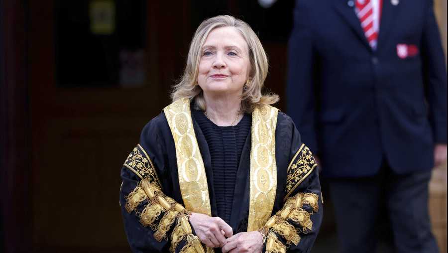 Former US Secretary of State Hillary Clinton poses for a photo after being inaugarated as the first female chancellor of Queens University, in Belfast, Northern Ireland, Friday, Sept. 24, 2021. (AP Photo/Peter Morrison)