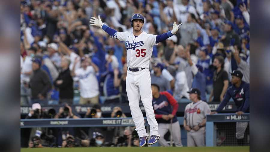 Los Angeles Dodgers center fielder Cody Bellinger reacts after hitting a three-run home run during the eighth inning in Game 3 of baseball's National League Championship Series against the Atlanta Braves Tuesday, Oct. 19, 2021, in Los Angeles.