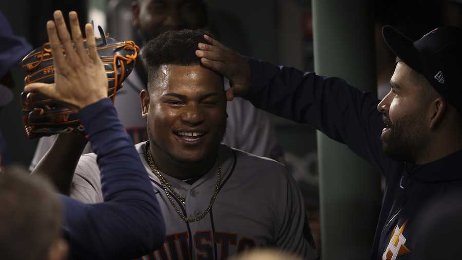 Houston Astros starting pitcher Framber Valdez celebrates in the dugout after the eighth inning in Game 5 of baseball's American League Championship Series against the Boston Red Sox Wednesday, Oct. 20, 2021, in Boston.