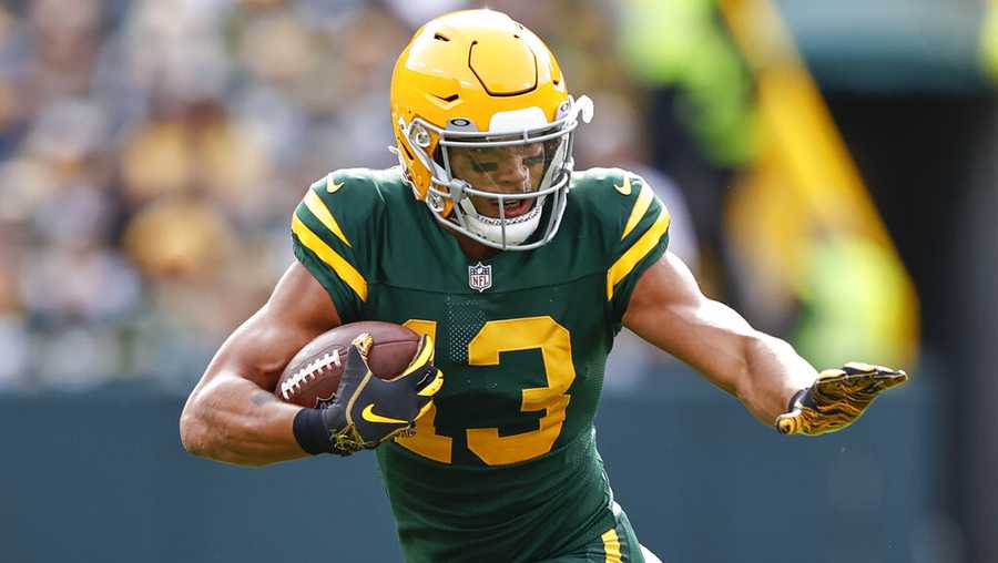 Green Bay Packers wide receiver Allen Lazard (13) rushes with the ball during the first half of an NFL football game against the Washington Football Team, Sunday, Oct. 24, 2021, in Green Bay, Wis. (AP Photo/Kamil Krzaczynski)