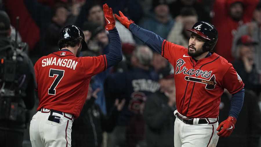 Atlanta Braves&apos; Travis d&apos;Arnaud celebrates his home run with Dansby Swanson during the eighth inning in Game 3 of baseball&apos;s World Series between the Houston Astros and the Atlanta Braves Friday, Oct. 29, 2021, in Atlanta.