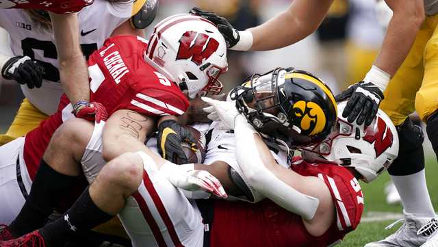 Defense carries Wisconsin to 27-7 triumph over No. 9 Iowa - Vimarsana News