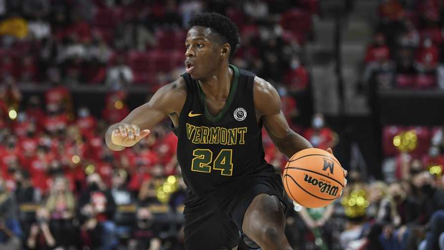 Vermont guard Ben Shungu (24) drives to the basket during the first half of an NCAA college basketball game against Maryland, Saturday, Nov. 13, 2021, in College Park, Md. (AP Photo/Terrance Williams)