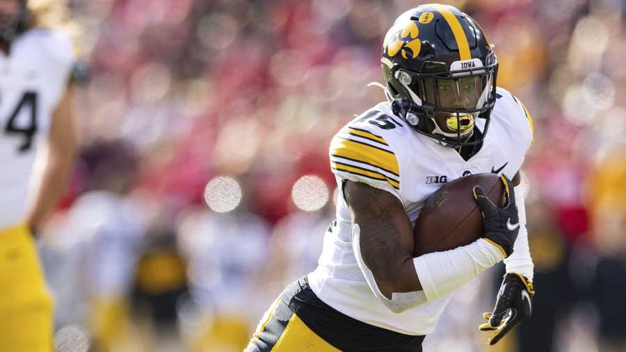 Iowa running back Tyler Goodson (15) rushes against Nebraska during the first half of an NCAA college football game Friday, Nov. 26, 2021, at Memorial Stadium in Lincoln, Neb. (AP Photo/Rebecca S. Gratz)