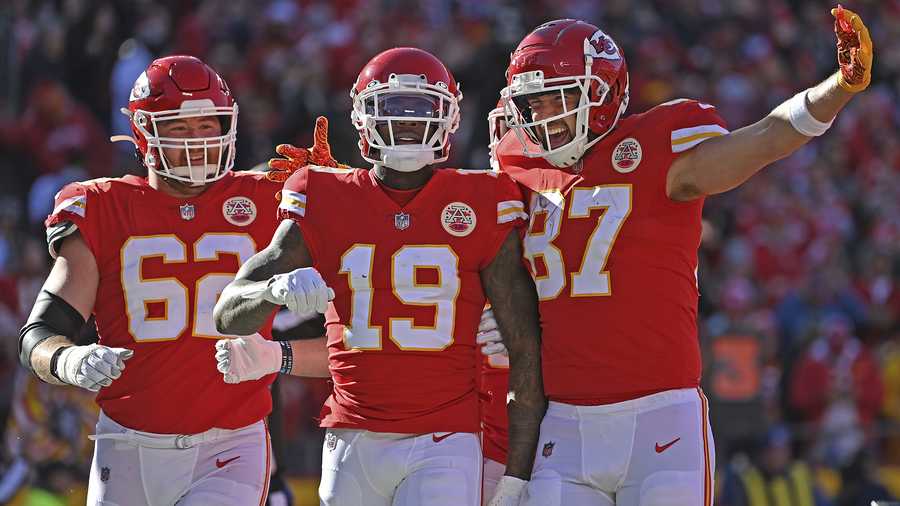 Kansas City Chiefs wide receiver Josh Gordon (19) celebrates with teammates tight end Travis Kelce (87) and guard Joe Thuney (62) after scoring a touchdown during an NFL football game against the Las Vegas Raiders Sunday, Dec. 12, 2021, in Kansas City, Mo. (AP Photo/Peter Aiken)