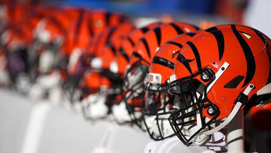 Cincinnati Bengals helmets sit on the bench during the first half of an NFL football game against the Denver Broncos, Sunday, Dec. 19, 2021, in Denver. (AP Photo/David Zalubowski)