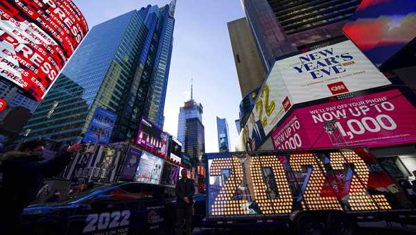 FILE - The 2022 sign that will be lit on the top of a building on New Year's Eve is displayed in Times Square, New York, Monday, Dec. 20, 2021. (AP Photo/Seth Wenig, File)