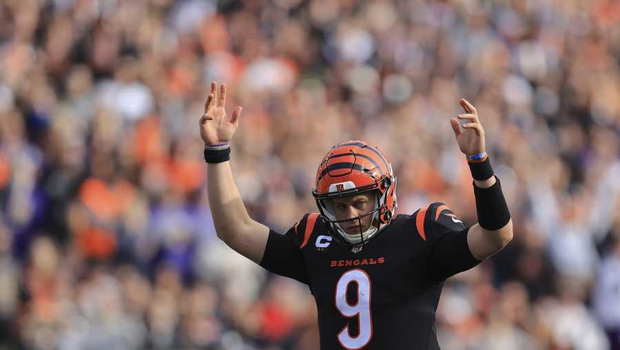 Cincinnati Bengals quarterback Joe Burrow (9) reacts after a touchdown during the first half of an NFL football game against the Baltimore Ravens, Sunday, Dec. 26, 2021, in Cincinnati. (AP Photo/Aaron Doster)