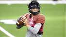 Cincinnati quarterback Desmond Ridder looks for an open receiver during practice for the Cotton Bowl NCAA football game, Monday, Dec. 27, 2021, in Arlington, Texas. (AP Photo/Brandon Wade) Desmond Ridder