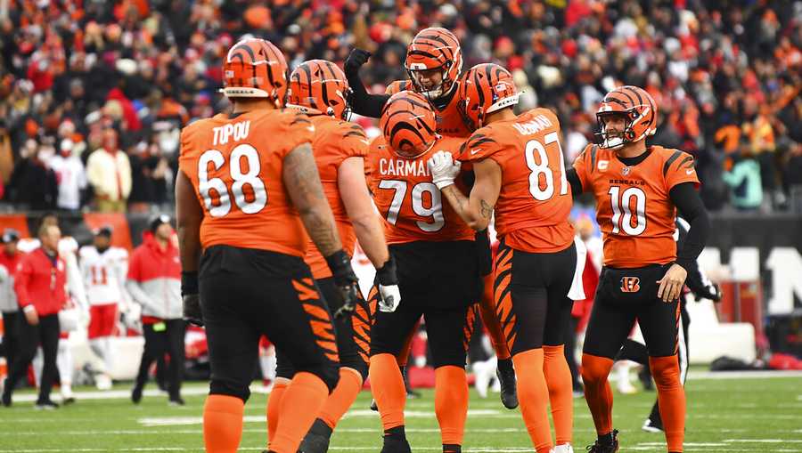 Cincinnati Bengals kicker Evan McPherson (2) celebrates with teammates after kicking the game winning field goal in the second half to beat the Kansas City Chiefs 34-31 during an NFL football game, Sunday, Jan. 2, 2022, in Cincinnati. (AP Photo/Emilee Chinn)