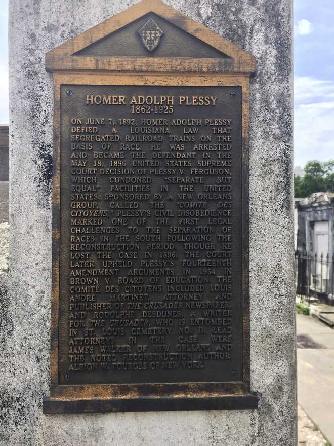 FILE&#x20;-&#x20;This&#x20;June&#x20;3,&#x20;2018&#x20;photo&#x20;shows&#x20;a&#x20;marker&#x20;on&#x20;the&#x20;burial&#x20;site&#x20;for&#x20;Homer&#x20;Plessy&#x20;at&#x20;St.&#x20;Louis&#x20;No.&#x20;1&#x20;Cemetery&#x20;in&#x20;New&#x20;Orleans.&#x20;Homer&#x20;Plessy,&#x20;the&#x20;namesake&#x20;of&#x20;the&#x20;U.S.&#x20;Supreme&#x20;Court&amp;apos&#x3B;s&#x20;1896&#x20;&quot;separate&#x20;but&#x20;equal&quot;&#x20;ruling,&#x20;was&#x20;granted&#x20;a&#x20;posthumous&#x20;pardon,&#x20;Wednesday,&#x20;Jan.&#x20;5,&#x20;2022.&#x20;The&#x20;Creole&#x20;man&#x20;of&#x20;color&#x20;died&#x20;with&#x20;a&#x20;conviction&#x20;still&#x20;on&#x20;his&#x20;record&#x20;for&#x20;refusing&#x20;to&#x20;leave&#x20;a&#x20;whites-only&#x20;train&#x20;car&#x20;in&#x20;New&#x20;Orleans&#x20;in&#x20;1892.