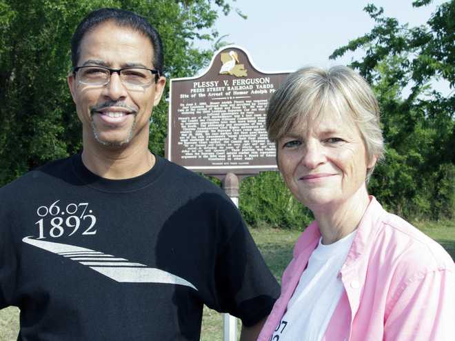 FILE&#x20;-&#x20;Keith&#x20;Plessy&#x20;and&#x20;Phoebe&#x20;Ferguson,&#x20;descendants&#x20;of&#x20;the&#x20;principals&#x20;in&#x20;the&#x20;Plessy&#x20;V.&#x20;Ferguson&#x20;court&#x20;case,&#x20;pose&#x20;for&#x20;a&#x20;photograph&#x20;in&#x20;front&#x20;of&#x20;a&#x20;historical&#x20;marker&#x20;in&#x20;New&#x20;Orleans,&#x20;on&#x20;Tuesday,&#x20;June&#x20;7,&#x20;2011.&#x20;Homer&#x20;Plessy,&#x20;the&#x20;namesake&#x20;of&#x20;the&#x20;U.S.&#x20;Supreme&#x20;Court&amp;apos&#x3B;s&#x20;1896&#x20;&quot;separate&#x20;but&#x20;equal&quot;&#x20;ruling,&#x20;was&#x20;granted&#x20;a&#x20;posthumous&#x20;pardon,&#x20;Wednesday,&#x20;Jan.&#x20;5,&#x20;2022.&#x20;The&#x20;Creole&#x20;man&#x20;of&#x20;color&#x20;died&#x20;with&#x20;a&#x20;conviction&#x20;still&#x20;on&#x20;his&#x20;record&#x20;for&#x20;refusing&#x20;to&#x20;leave&#x20;a&#x20;whites-only&#x20;train&#x20;car&#x20;in&#x20;New&#x20;Orleans&#x20;in&#x20;1892.
