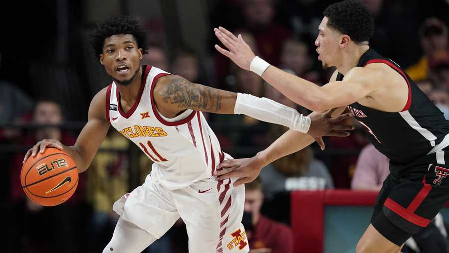 Iowa State guard Tyrese Hunter (11) drives around Texas Tech guard Clarence Nadolny, right, during the second half of an NCAA college basketball game, Wednesday, Jan. 5, 2022, in Ames, Iowa. (AP Photo/Charlie Neibergall)
