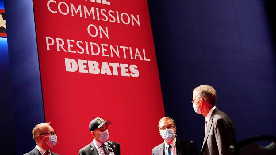 FILE - Officials from the Commission on Presidential Debates gather near the stage before the start of the second and final presidential debate, Oct. 22, 2020, at Belmont University in Nashville, Tenn. The Republican National Committee says it is planning a rules change that would force presidential candidates seeking the party’s nomination to sign a pledge saying they will not participate in any debates sponsored by the Commission on Presidential Debates.