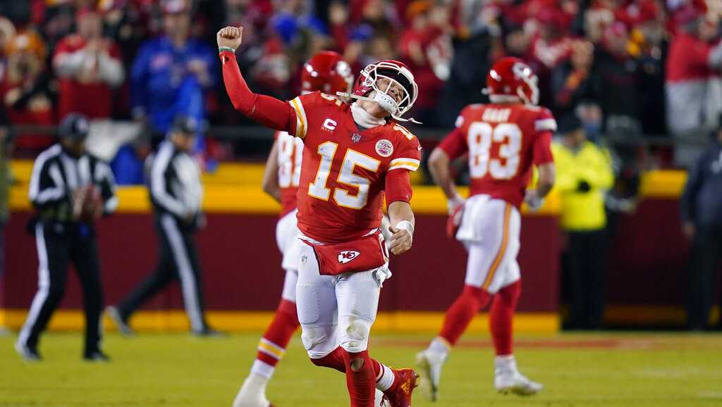 Kansas City Chiefs quarterback Patrick Mahomes (15) celebrates after  throwing a touchdown pass during the first half of an NFL divisional round  playoff football game against the Buffalo Bills, Sunday, Jan. 23