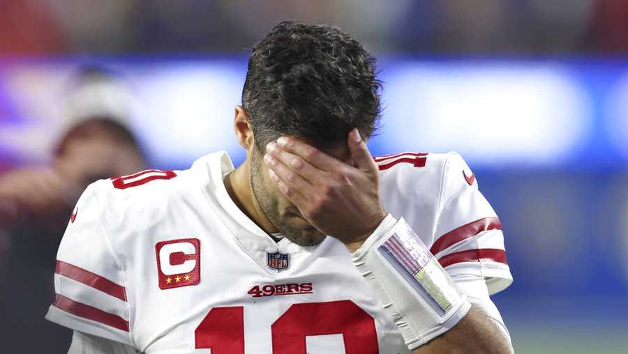 San Francisco 49ers&apos; Jimmy Garoppolo walks off the field after the NFC Championship NFL football game against the Los Angeles Rams Sunday, Jan. 30, 2022, in Inglewood, Calif. The Rams won 20-17 to advance to the Super Bowl. (AP Photo/Jed Jacobsohn)