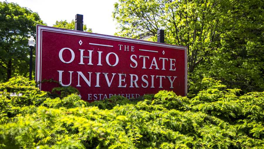 FILE - This May 8, 2019, file photo, shows a sign for Ohio State University in Columbus, Ohio. A group of survivors of decades-old sexual abuse by a long-dead Ohio State team doctor have appealed a judge&apos;s dismissal of their lawsuits against the university. Hundreds of men allege that Richard Strauss abused them at campus athletic facilities, a student health center, his home or at an off-campus clinic, and some of those men reported multiple instances.   (AP Photo/Angie Wang, File)